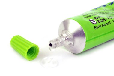 Tube of liquid glue close-up on white background clipart