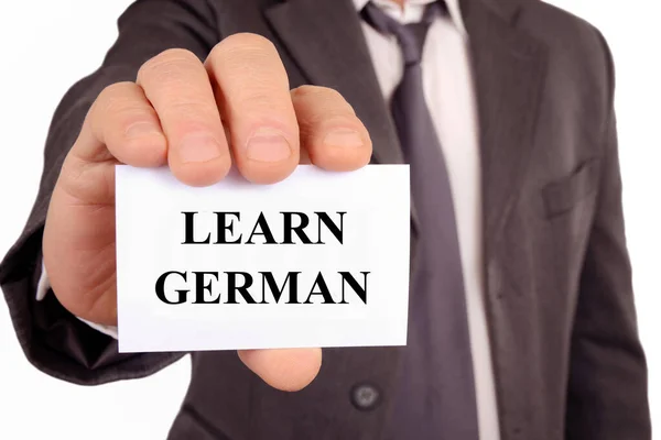Muž Držící Kartu Které Napsáno Učí Německy — Stock fotografie