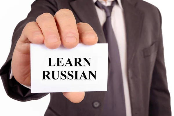 Muž Držící Kartu Které Napsáno Učí Rusky — Stock fotografie