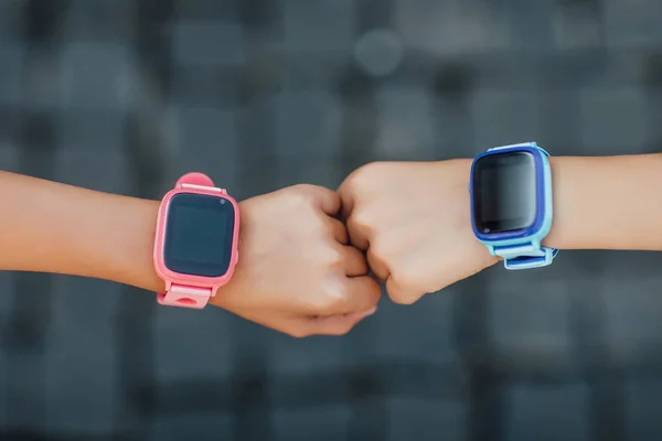 Children with smartwatches on hands, selective focus