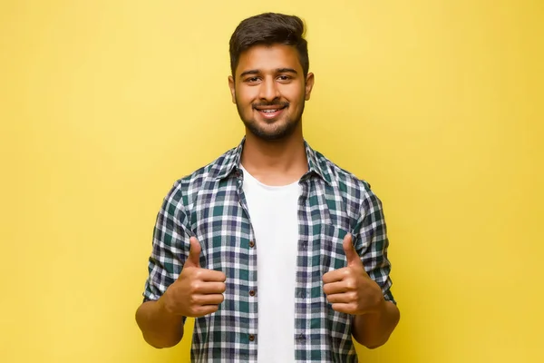 Young Indian Male Looking Tourist Turn Fingers Yellow Background — 스톡 사진