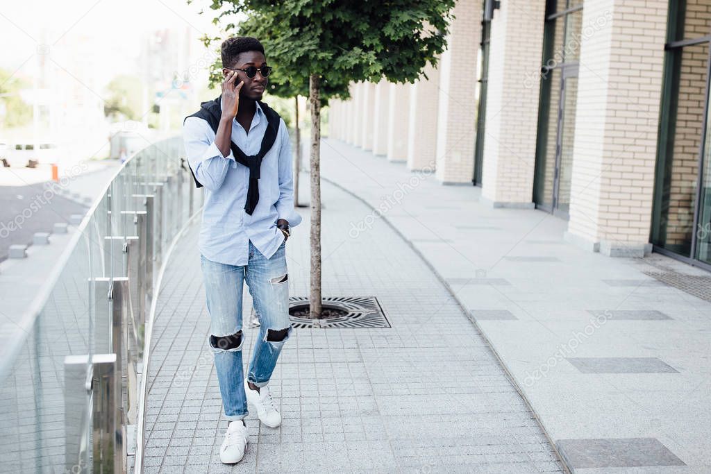 happy young man smiling at street, selective focus 