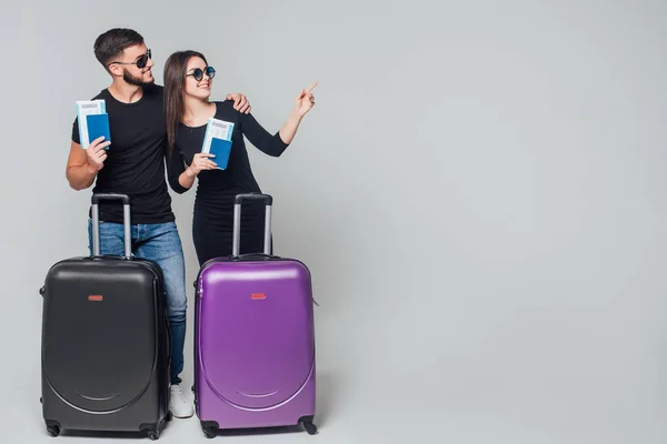 Smiling Young Happy Couple Suitcases Ticket Grey Background — 스톡 사진