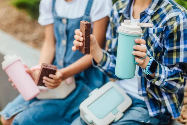 Boy Girl Sitting Building Chocolate Cakes Thermoses Hands — Stock Photo, Image