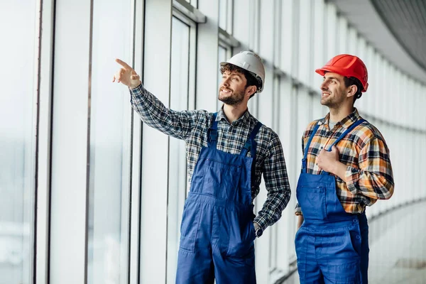 Two Builders Construction Stand Big Windows Hang Out Work — Stock Photo, Image