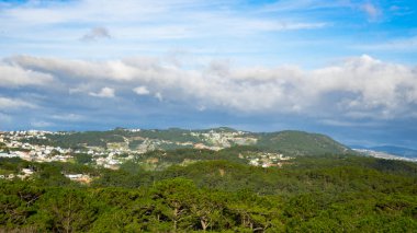 Cityscape of Dalat, Vietnam.Beautiful landscape view for mountains and buildings.Beautiful tiny houses.Da lat city in the blue sky background