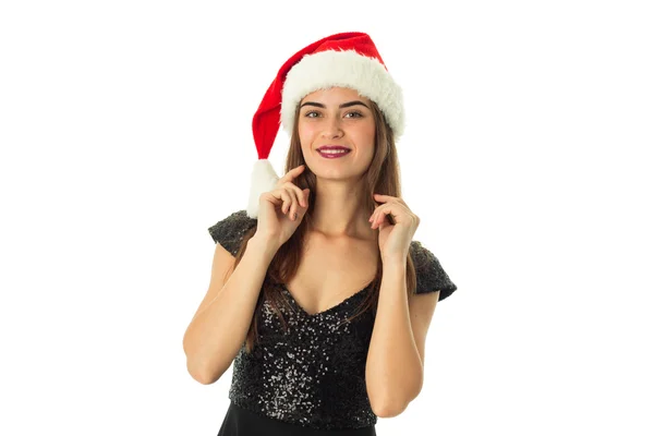 快乐的漂亮女孩，在圣诞老人的帽子 — 图库照片