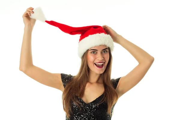 Allegra ragazza in cappello di Babbo Natale — Foto Stock