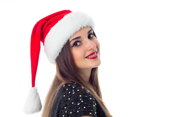 性格开朗的黑发女孩在圣诞老人的帽子 — 图库照片