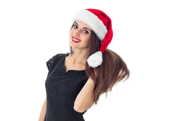 年轻的女孩，在圣诞老人的帽子微笑 — 图库照片
