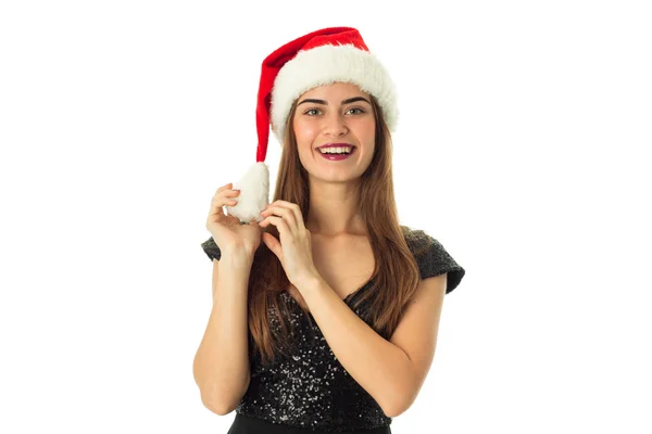 Jeune fille heureuse dans le chapeau de Père Noël — Photo