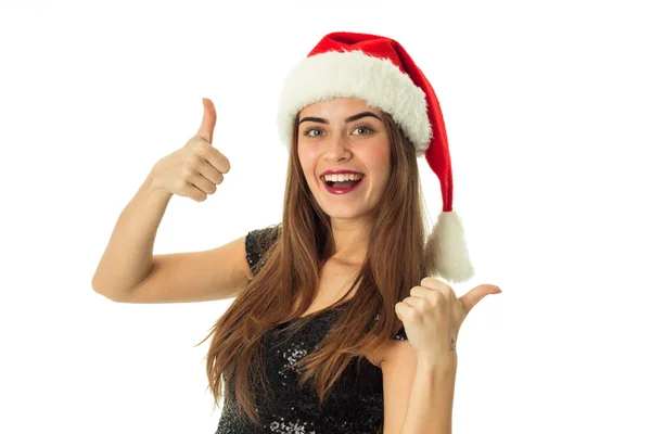 活泼开朗的漂亮女孩在圣诞老人的帽子的肖像 — 图库照片