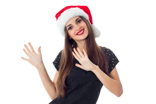 Happy brunette girl in santa hat — Stock Photo, Image