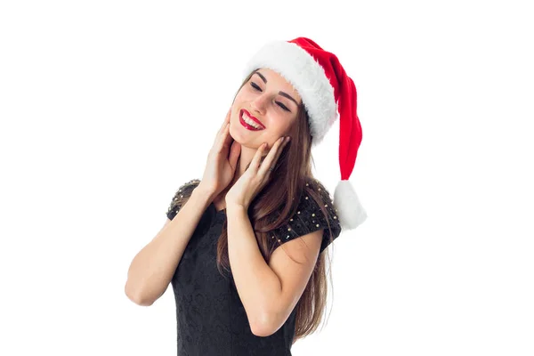 닫힌된 눈을 가진 산타 모자에 갈색 머리 소녀 — 스톡 사진
