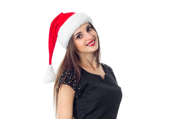 Junges hübsches Mädchen mit Weihnachtsmann-Hut — Stockfoto