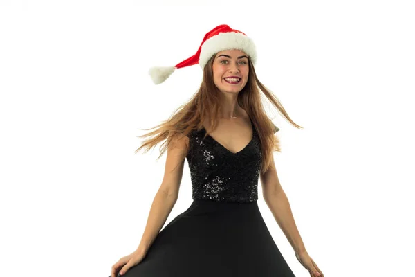Porträtt av glad vacker flicka i santa hatt — Stockfoto