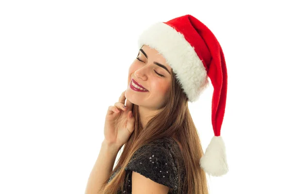 快乐可爱的女人，在圣诞老人的帽子 — 图库照片