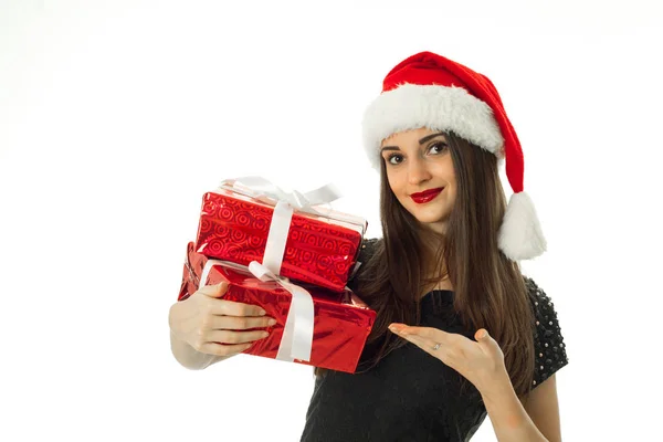 Happy girl in santa hat with red gift — Stock Photo, Image