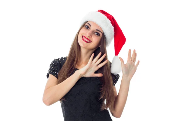 Allegra ragazza bruna in cappello di Babbo Natale — Foto Stock