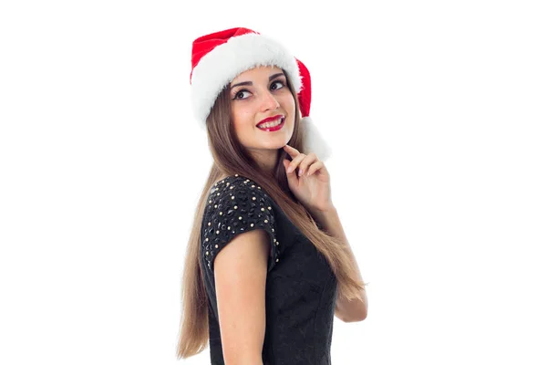Дівчина в капелюсі Санта посміхається — стокове фото