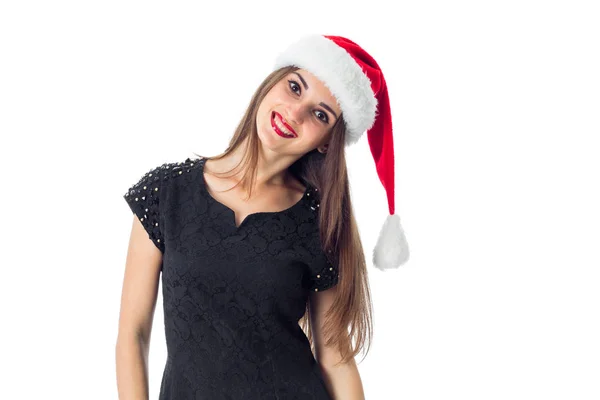 年轻迷人的女孩，在圣诞老人的帽子 — 图库照片