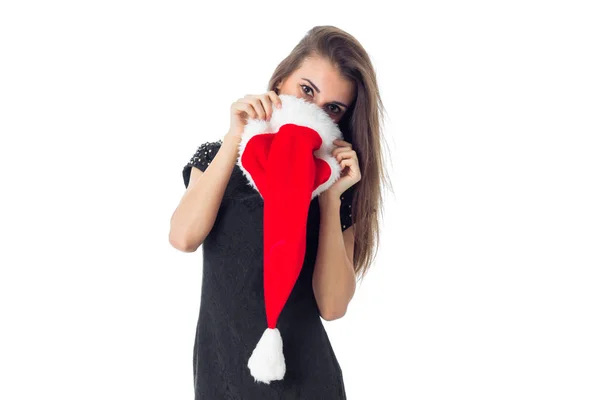 Divertente ragazza in Babbo Natale cappello sorridente — Foto Stock