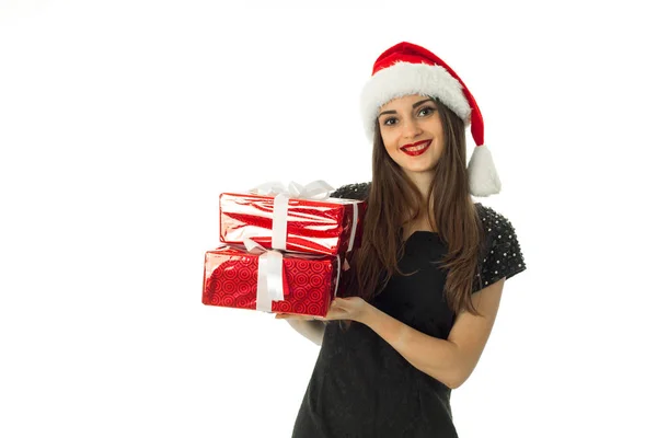 Beautiful girl in santa hat with red gift — Stock Photo, Image