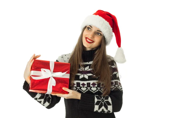 Adorable girl in warm sweater and santa hat — Stock Photo, Image