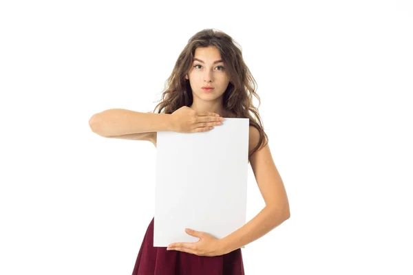 Girl in red dress with white placard — Stock Photo, Image