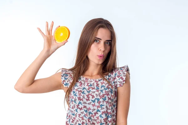 Girl with orange slices in hands — Stock Photo, Image