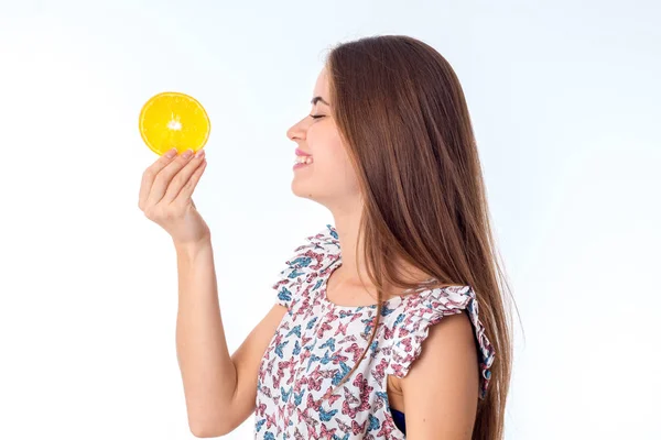 Girl with orange slices in hands — Stock Photo, Image