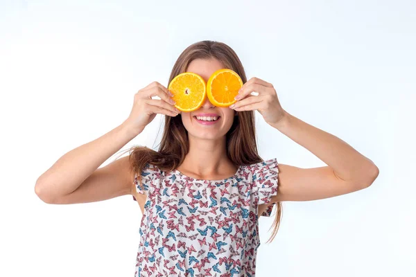 Girl with orange slices in hands — Stock Photo, Image
