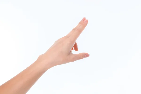 Hand tonen het gebaar met een schrapen elkaar uw wijs- en middelvinger — Stockfoto