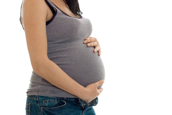 Hamile kadın poz yüz olmadan beyaz arka plan üzerinde izole genç — Stok fotoğraf