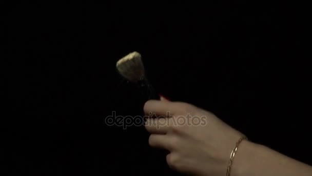 Girl holding a brush and pours powder — Stock Video