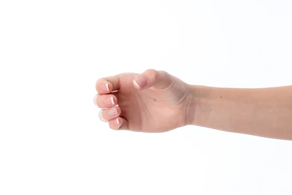 Kiterjesztett előre női kéz gesztus hajlított ujjakkal mutatja a elszigetelt fehér háttér — Stock Fotó