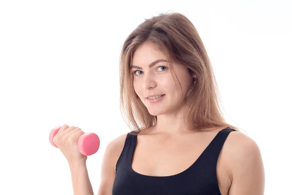 Close-up van een lachende sportieve meid die van halter houdt — Stockfoto