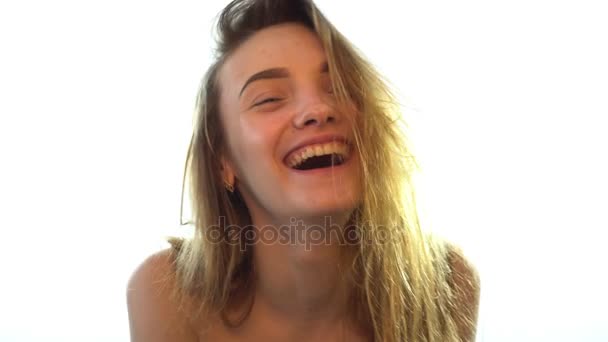 Young girl laughs and straightens hair — Stock Video