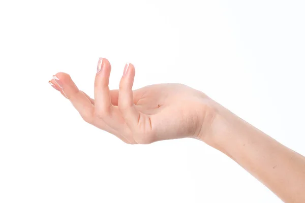 Mão feminina mostrando o gesto com as palmas das mãos levantadas para cima e dedos isolados em fundo branco — Fotografia de Stock