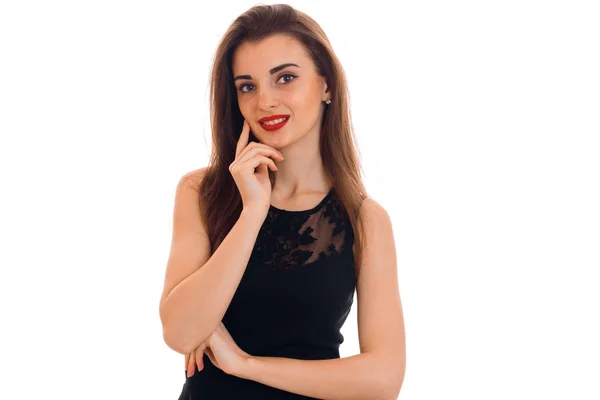 Portrait of cheerful young brunette with red lips in black dress looking at the camera and smiling isolated on white background — Stock Photo, Image