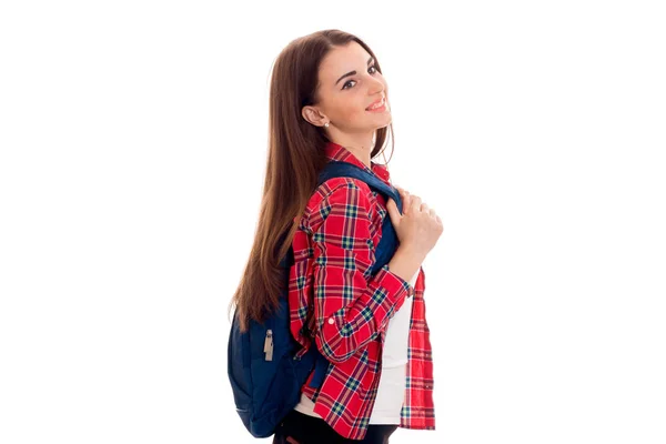 Attraktive junge brünette Studentin Mädchen mit blauem Rucksack isoliert auf weißem Hintergrund — Stockfoto