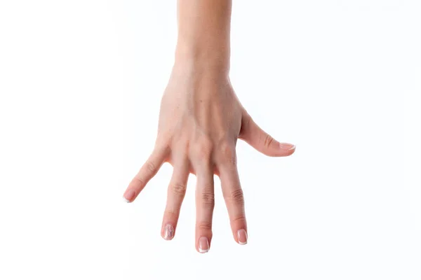 Mão feminina esticada para baixo e mostrando os cinco dedos é isolado em um fundo branco — Fotografia de Stock