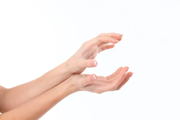 Two womens hands are outstretched to the side and lying on top of one another with palms is isolated on a white background — Stock Photo, Image