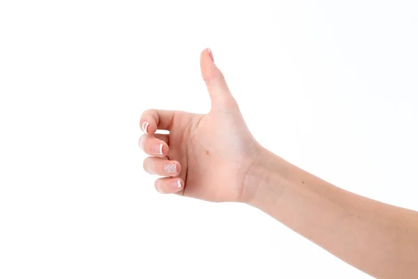 Mano femenina mostrando el gesto con el pulgar levantado hacia arriba aislado sobre fondo blanco — Foto de Stock