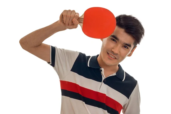 Vrolijke jonge brunett sportman beoefenen ping-pong geïsoleerd op witte achtergrond — Stockfoto