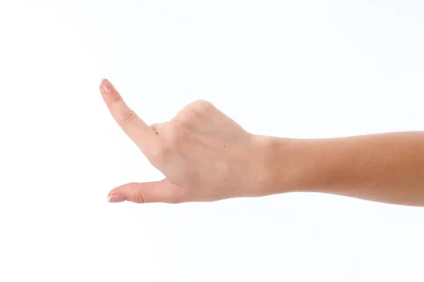 Mano femenina mostrando el gesto con el dedo índice levantado hacia arriba aislado sobre fondo blanco — Foto de Stock