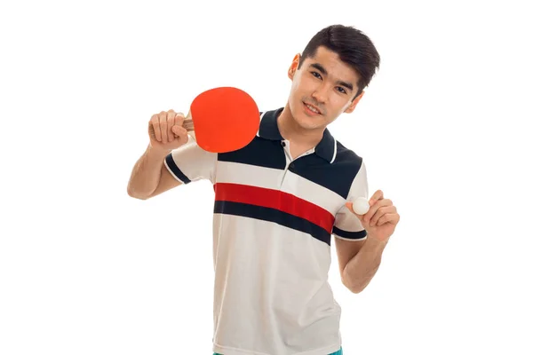 Schöner junger brünetter Mann spielt Ping-Pong isoliert auf weißem Hintergrund — Stockfoto