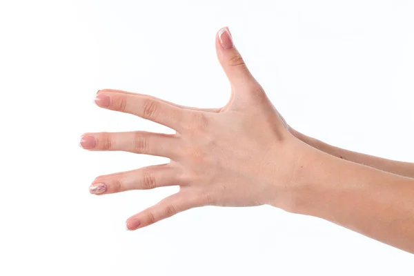 Female hand outstretched to the side and showing the five fingers is isolated on a white background — Stock Photo, Image