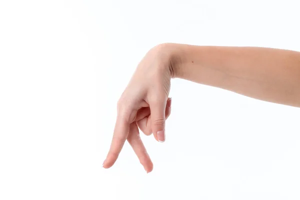 Mão feminina mostrando o gesto com dois dedos para baixo isolado em fundo branco — Fotografia de Stock