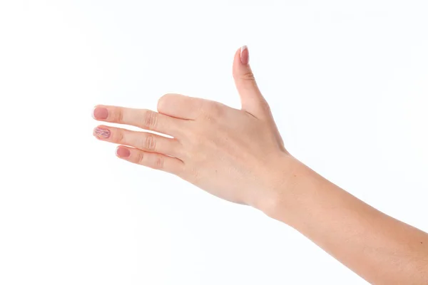 Mão feminina estendida para o lado e mostrando o gesto com as palmas das mãos retas dobradas indicador isolado no fundo branco — Fotografia de Stock